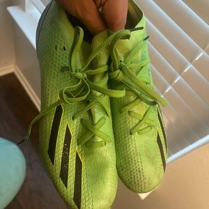 neon colored soccer cleats
